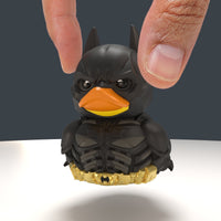 A person's holding DC Comics The Dark Knight Batman TUBBZ (Mini Edition)