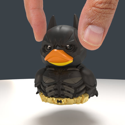 A person's holding DC Comics The Dark Knight Batman TUBBZ (Mini Edition)