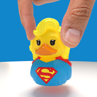 A person holding Supergirl Mini TUBBZ