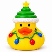 Mini christmas festive lights rubber duck on a white background
