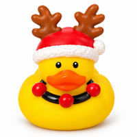 Mini christmas reindeer hat rubber duck on a white background