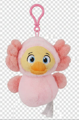 Pink plush keychain with a cartoon face on a black background