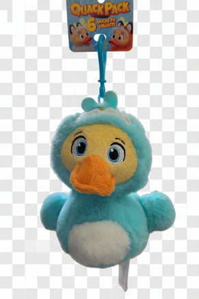 Blue plush duck toy with an orange beak on a black background