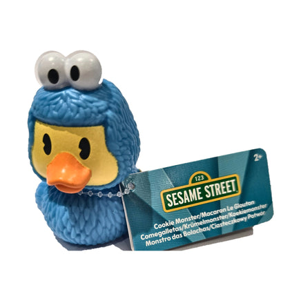 Cookie Monster Duckalooz rubber duck with attached Sesame Street product tag on white background