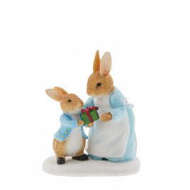 Mrs. Rabbit™ Passing Peter Rabbit™ a Present Figurine  - Winter Collection