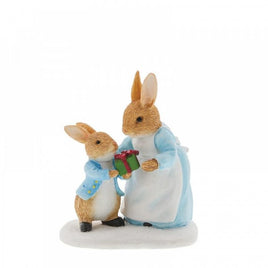Mrs. Rabbit™ Passing Peter Rabbit™ a Present Figurine  - Winter Collection